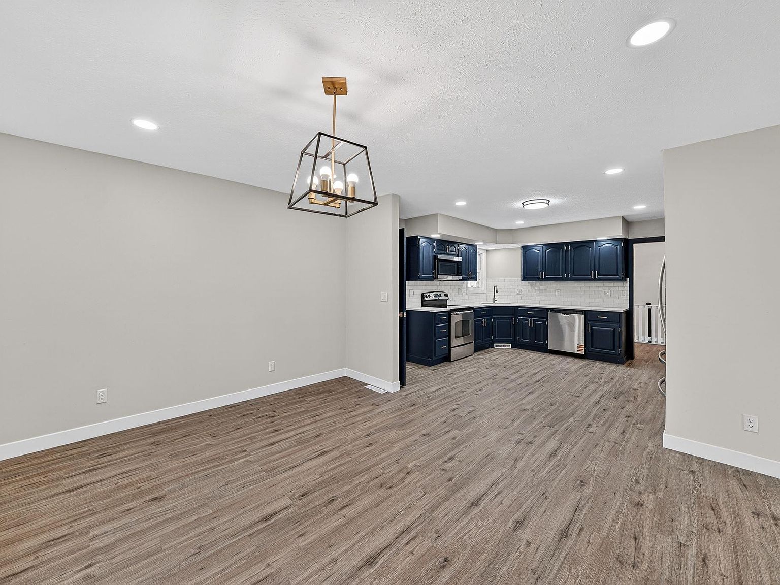 Completed kitchen and dining room with new hardwood flooring